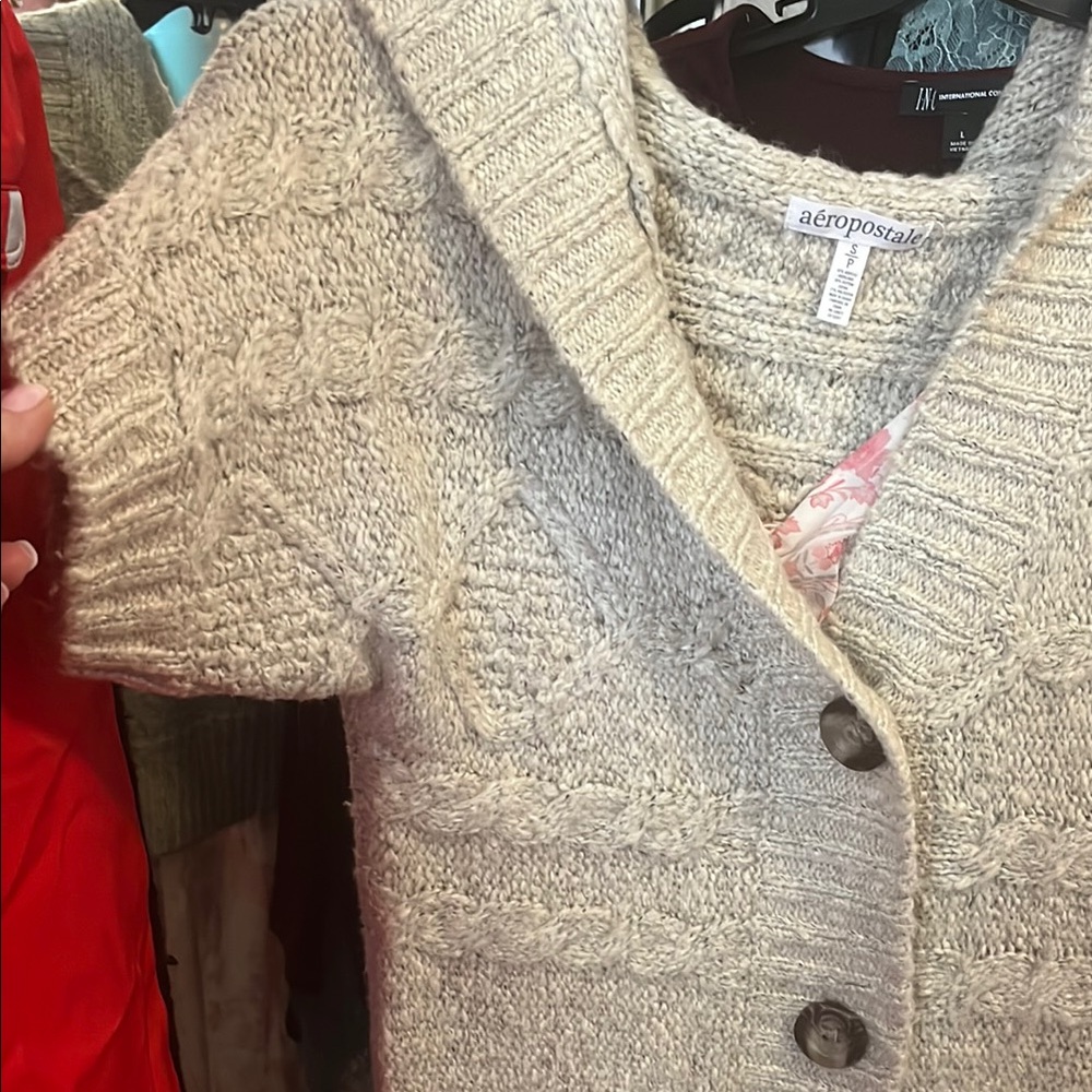 A hooded soft button up half sleeve sweater I’m also including the dress (small)